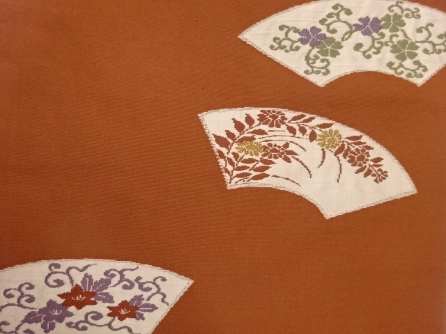  地紙に草花模様織出し名古屋帯